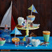 yellow cake stand with party decor